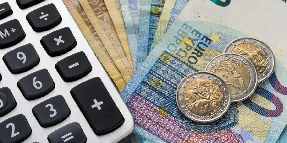 close up of a calculator and euro money in a financial analyzing concept