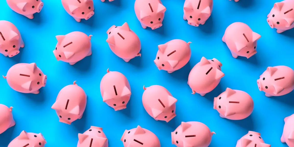 lots of pink piggy banks on a blue background top view 3d render