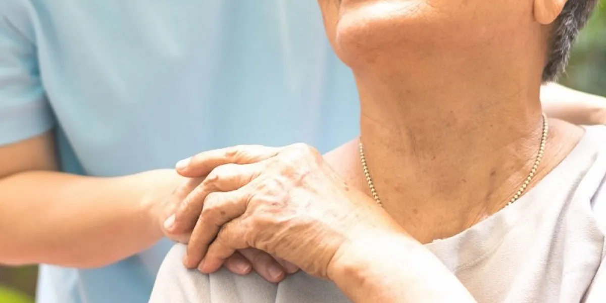 geriatric doctor or geriatrician concept doctor physician hand on happy elderly senior patient to comfort in hospital examination room or hospice nursing home or wellbeing county