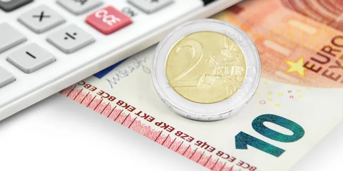 12,00 euro and calculator closeup