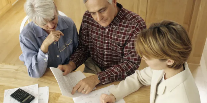 senior couple meeting with agent