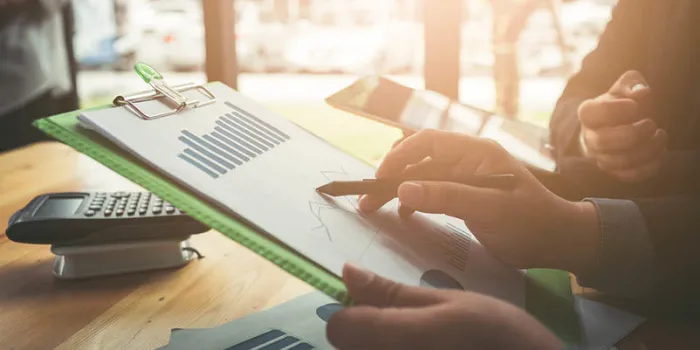 vat and loan rates calculated by the bank of according to the tax code of the government business man asian hard working in the office calculating tax incomebusiness conferencing and meetings in a private room of consultants for internal management