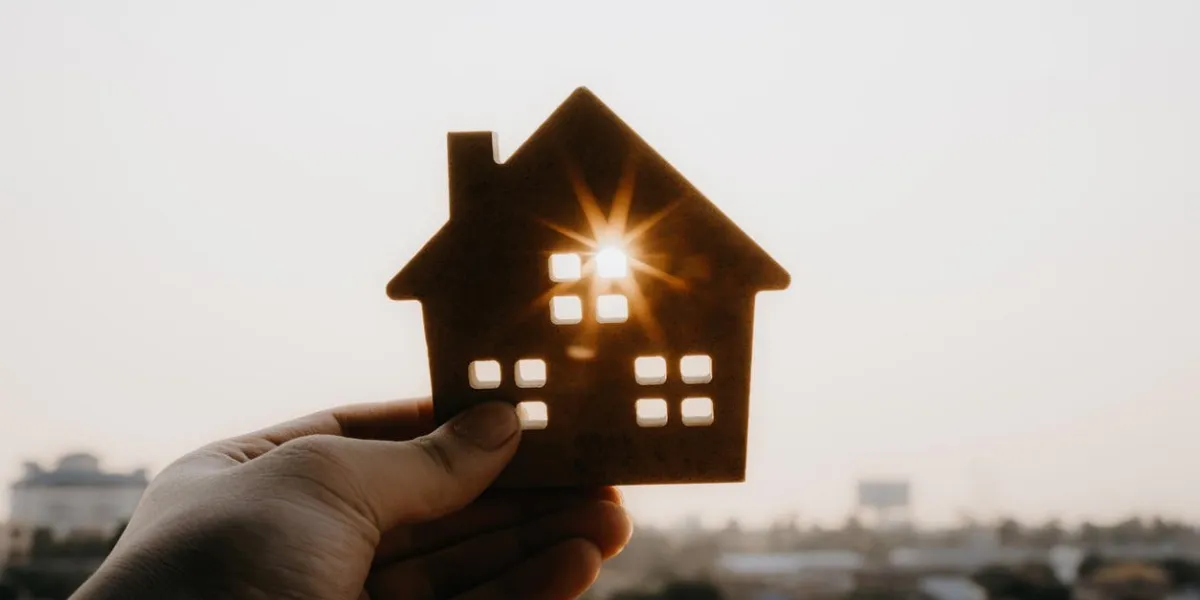 house model in home insurance broker agent u2018s hand or in salesman person real estate agent offer house, property insurance and security, affordable housing concepts