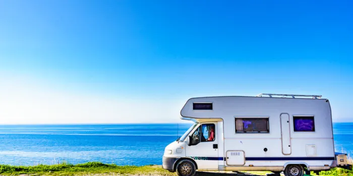 camper rv caravan on mediterranean coast in spain wild camping on sea shore holidays and travel in motor home