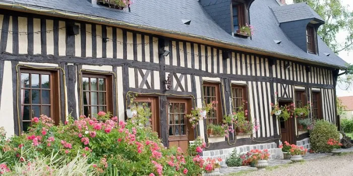 la neuville-chant-d'oisel (seine-maritime, haute normandie, france) - exterior of old half-timbered house with flowers
