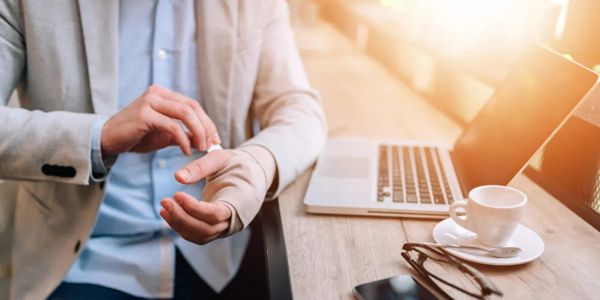 close-up image of a bandaged businessman's hand