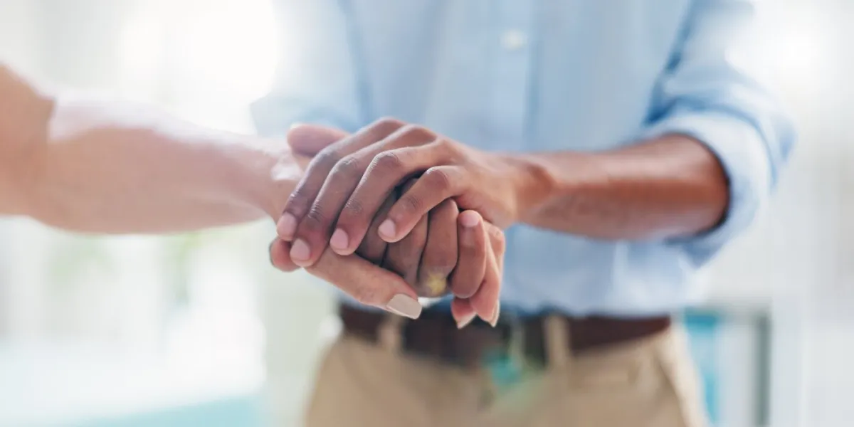 doctor, patient and hands of empathy closeup at hospital with bad news, results or cancer diagnosis healthcare, support and male surgeon with sick woman for comfort, kindness or hope of recovery