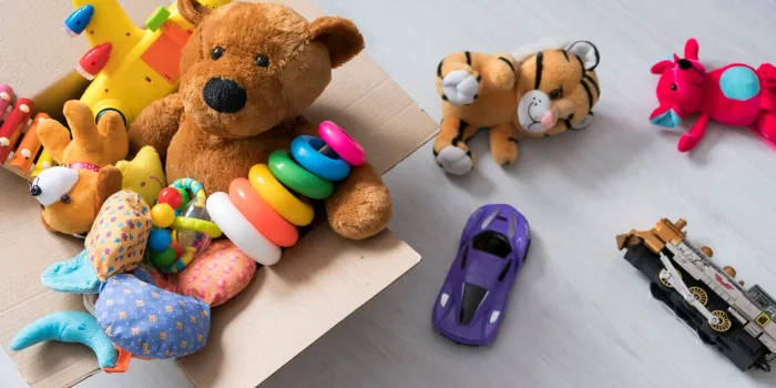 box of toys on the floor teddy bear in box,vintage tone charitable contribution donation beneficence