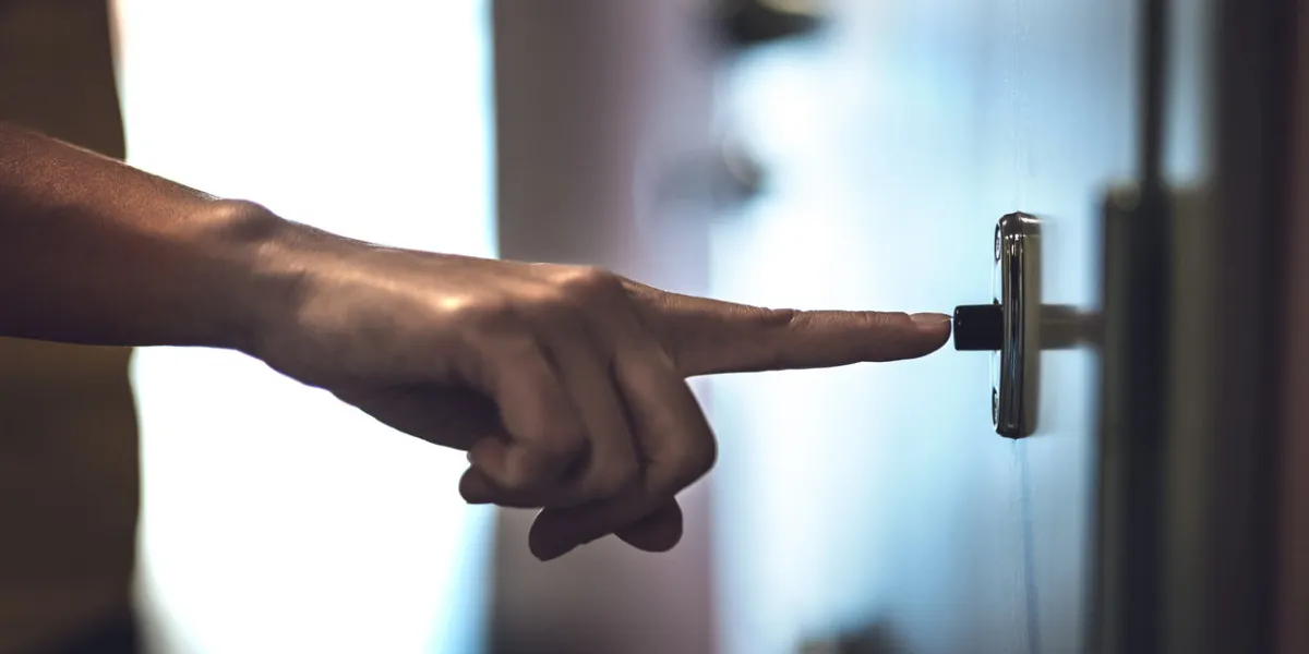 finger ringing doorbell hand pushing door bell friend visiting or unwanted guest neighbor complaining about noise police with bad news