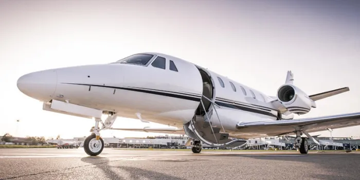 luxury business jet with open door ready for passenger boarding