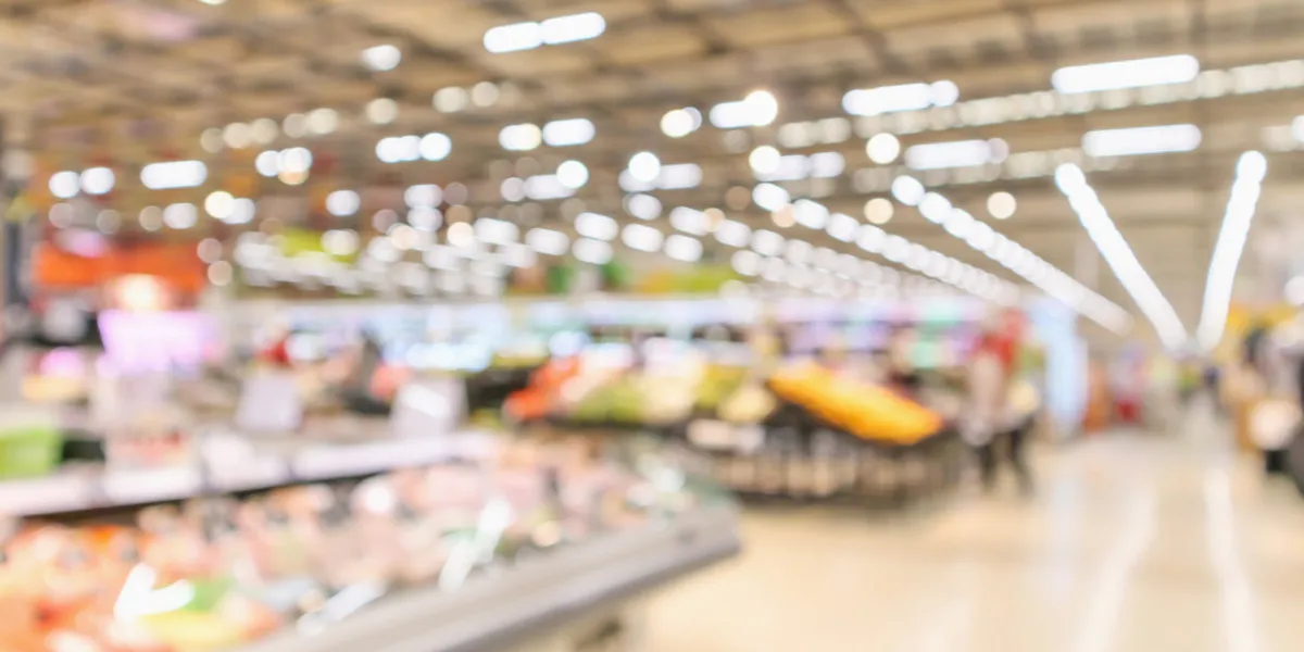 supermarket interior with grocery product blurred defocused background with bokeh light
