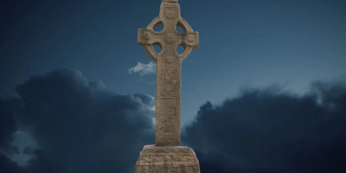 celtic cross in a cloudy night sky