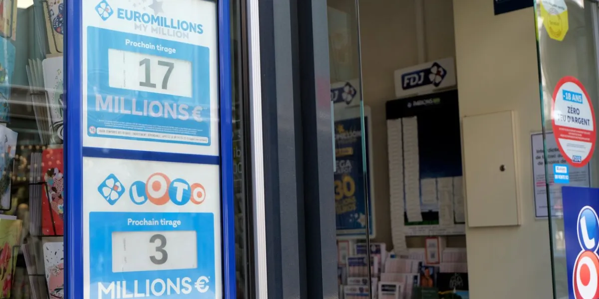 vannes, france, june 14, 2022  signs of loto and euromillions winnings on the window of a tobacco shop in france