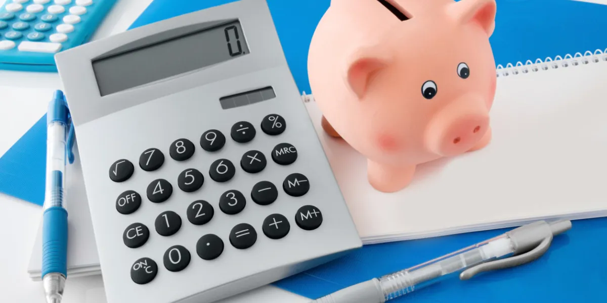 office desk and piggy bank close up