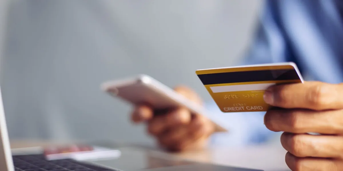 online payment hands holding credit card and using laptop online shopping concept