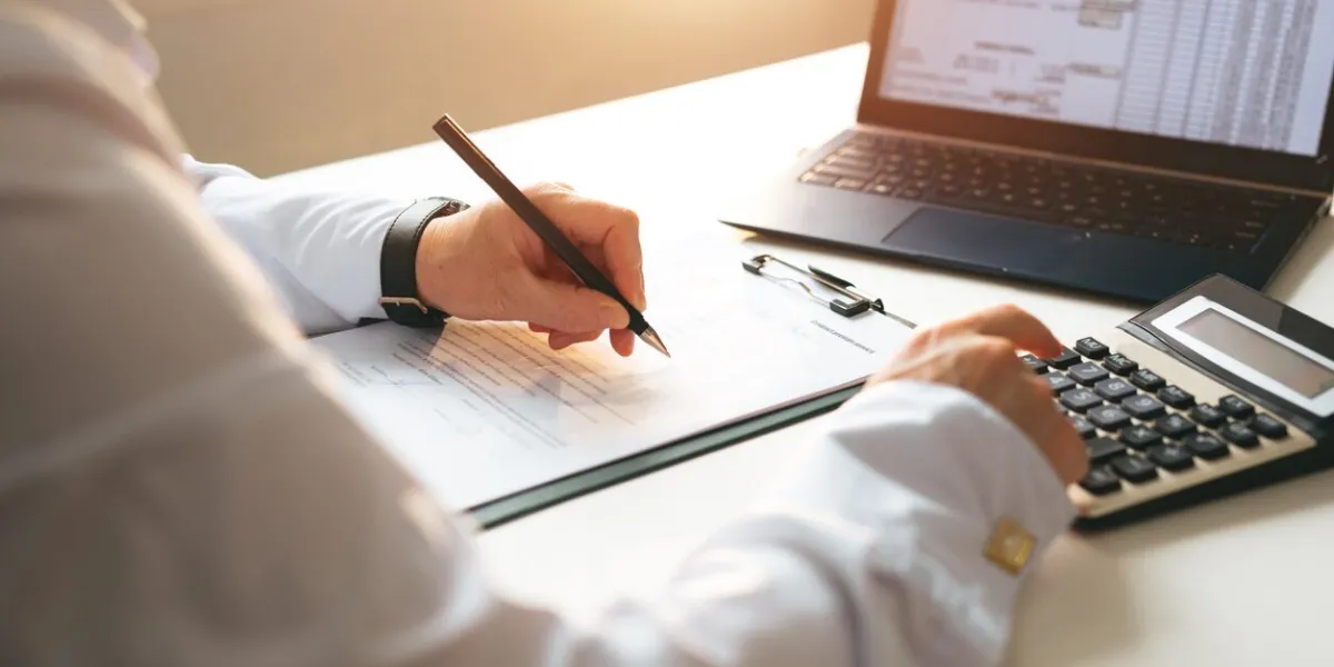 businessman calculating the financial statement of his business business panoramic banner with copy space accounting and tax