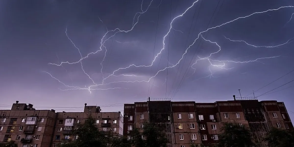 thunderstorm in the night sky on residential buildings