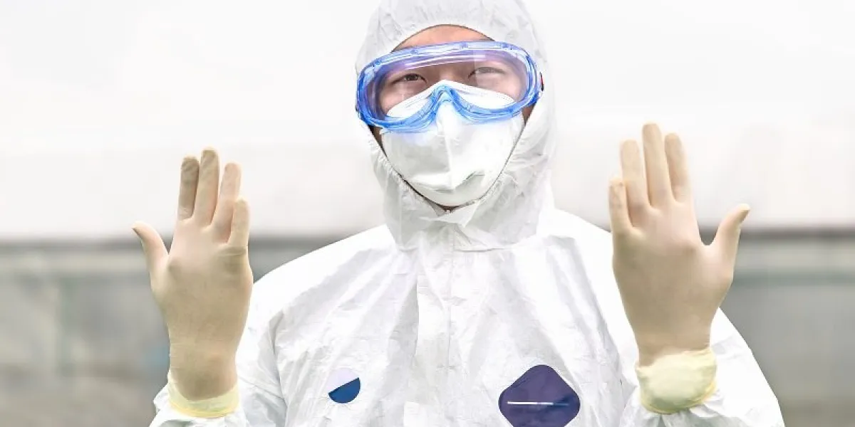 cdc expert in a hazmat suit