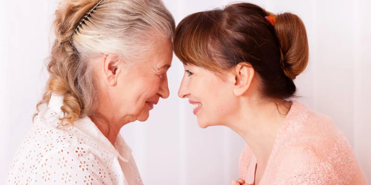 seniors woman with her caregiver at home