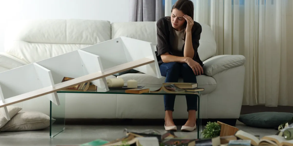 sad tenant complaining after home robbery in the night