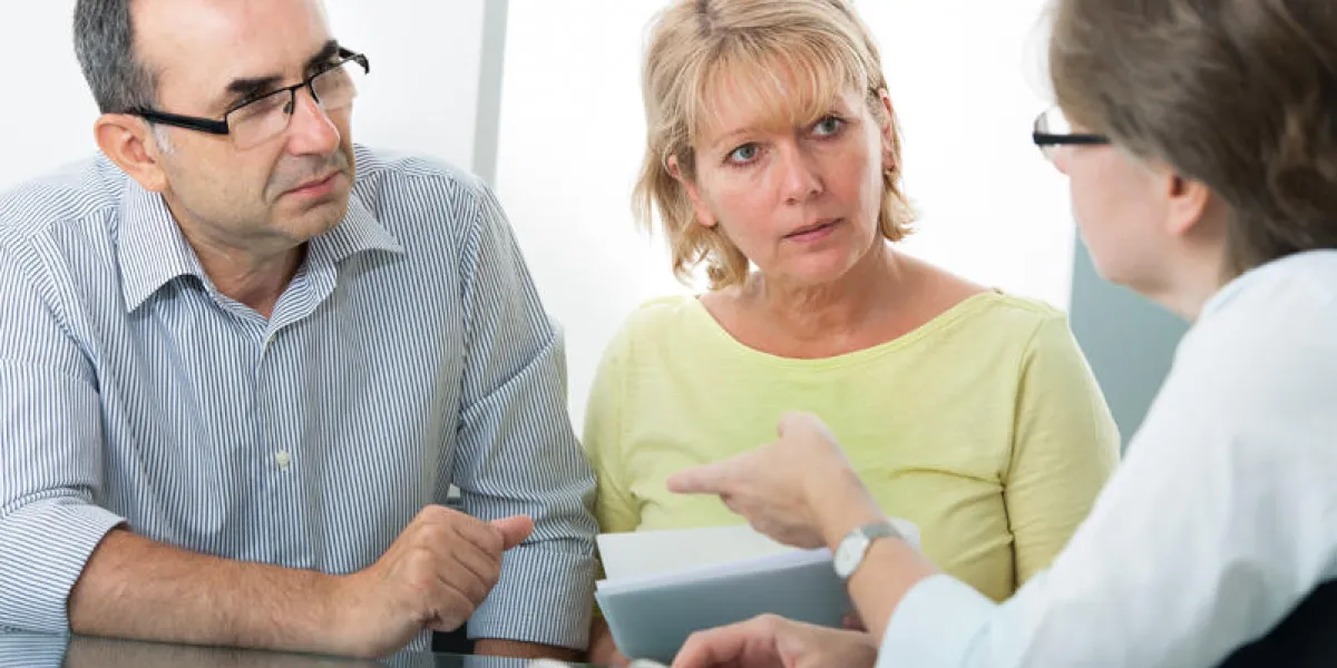 couple getting financial advice from consultant at home