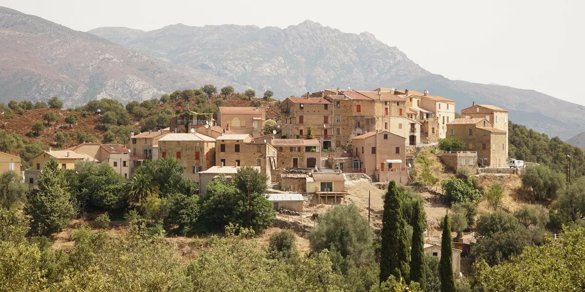 borgo village set on top of a hill in the countryside of the palasca region of corsica island, france