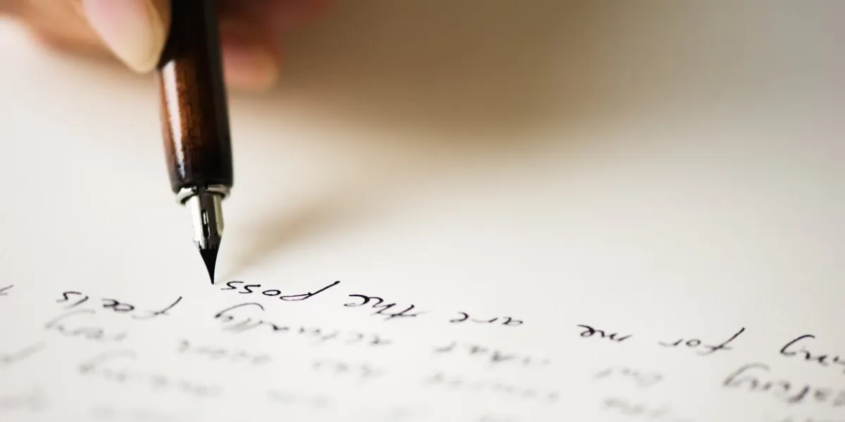 writing letter to a friend selective focus and shallow depth of field