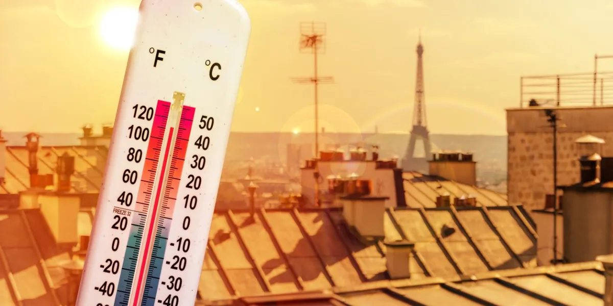 thermometer in front of paris skyline during heatwave in france