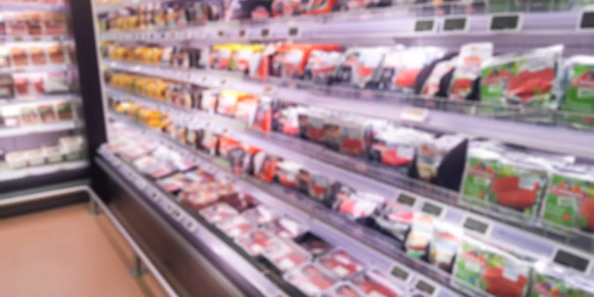 fresh supermarket interior in blurry background