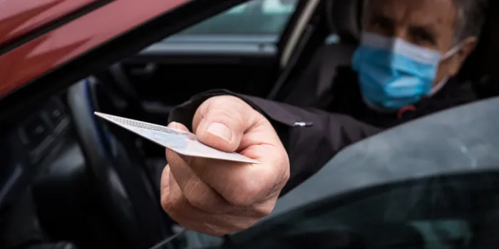 senior man traveling with facemask, slovenia on italian border