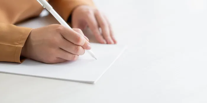 writing woman application form text document exam education unrecognizable lady going to making notes on blank white paper light table surface copy space