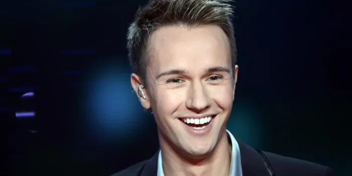 french tv host cyril feraud smiles during the 26th telethon, france's biggest annual fund-raising event broadcast live on television during 30 hours, on december 7, 2012 in saint-denis, north of paris afp photo   bertrand guay   afp photo   bertrand guay