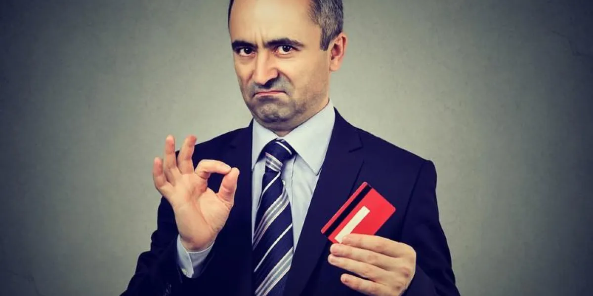 sly liar businessman employee reassuring their credit card is the best