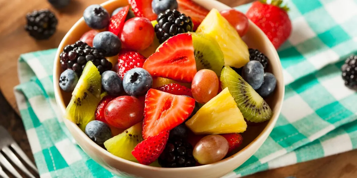 heallthy organic fruit salad with berries pineapple and grapes