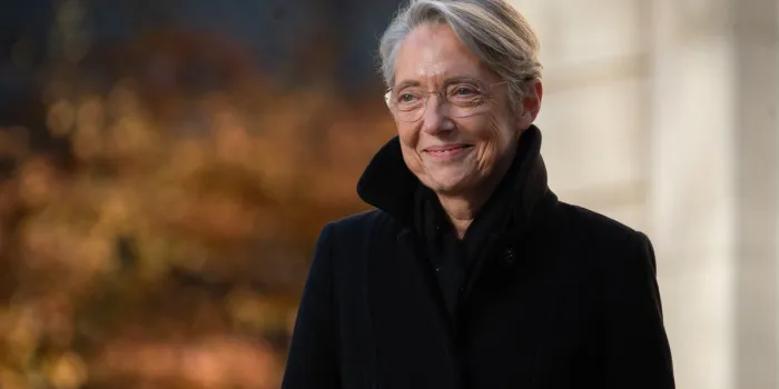 elisabeth borne plants a holm oak tree in the garden of matignon