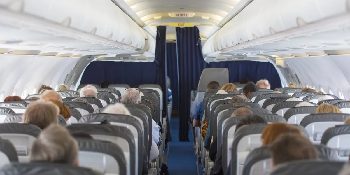 commercial aircraft cabin with passengers