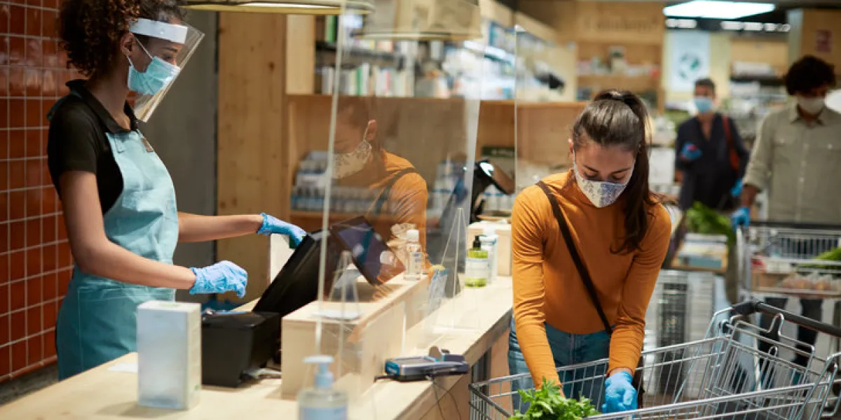 grocery shopping check out with a customer and a cashier