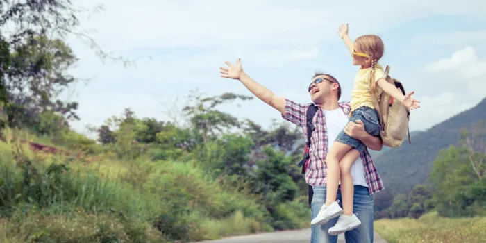father and daughter walking on the road at the day time concept of friendly familyfather and daughter walking on the road at the day time concept of friendly familyfather and daughter walking on the road at the day time concept of friendly family