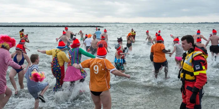 hellevoetsluis, netherlands - january 1, 2014  people going to swim for the new years dip in the haringvliet
