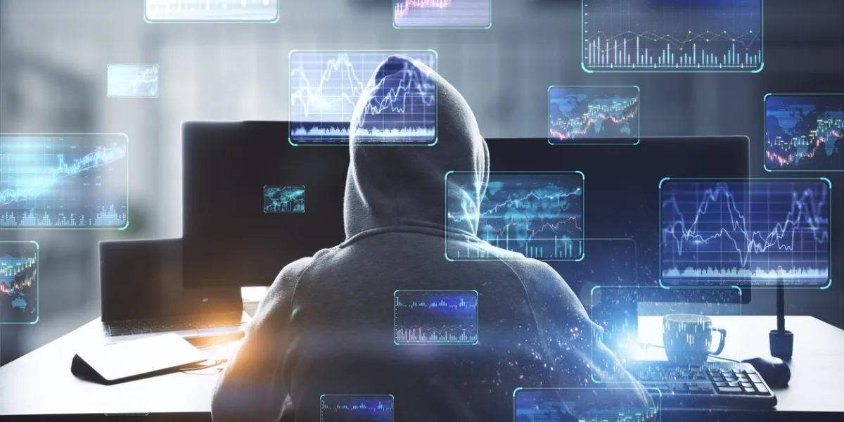 back view of hacker at desktop using computers with various forex screens on blurry office interior background cryptocurrency, hacking, bticoin trading and finance concept double exposure