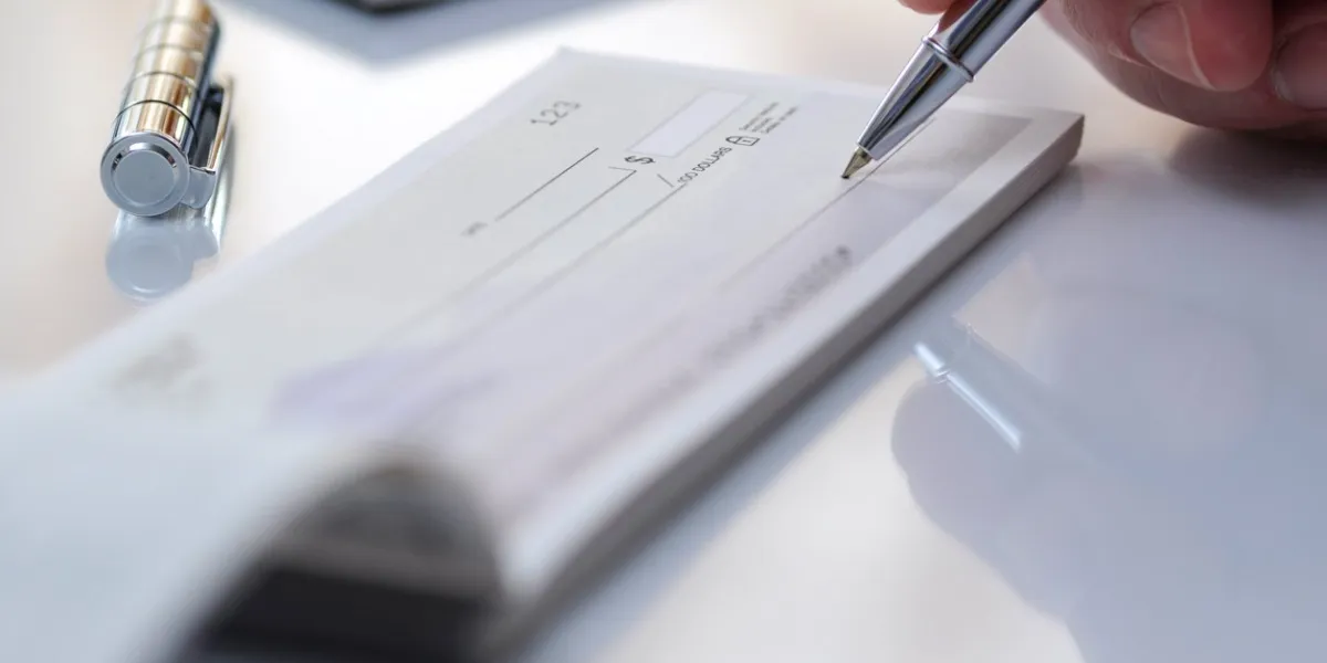 businessman prepare writing check in the office