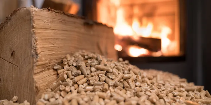 wood stove heating with in foreground wood pellets - economical heating system concept