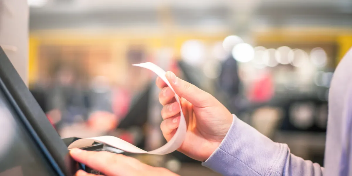 process of printing invoice for a customer, credit card processor, receipt printer with paper shopping bill and touchscreen monitor, pos