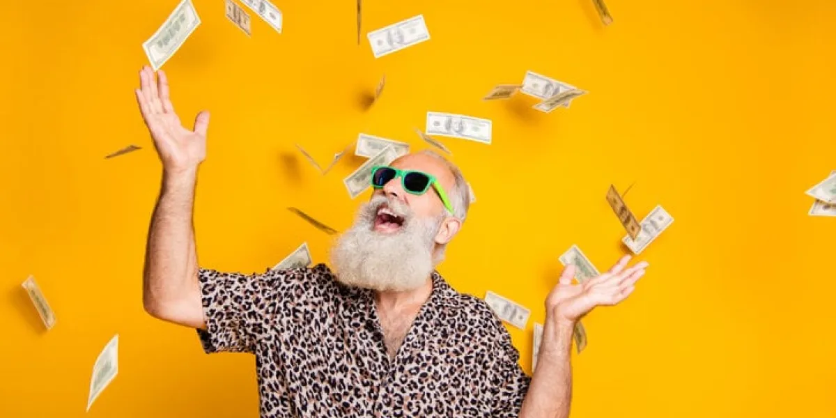 portrait of crazy funky funny old bearded man hipster in green eyeglasses, eyewear look up at money falling scream great win lottery wear leopard stylish shirt isolated over yellow background