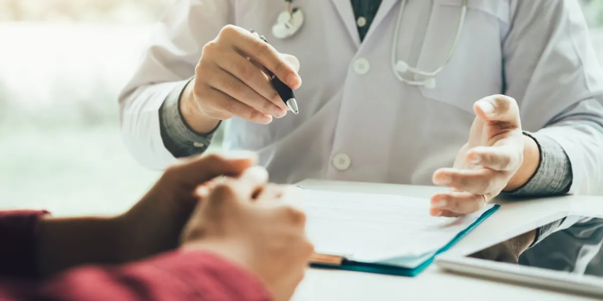 doctor talking to the patient about menopause and treatment in future