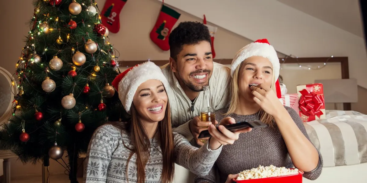 friends watching movie and having fun at christmas eve