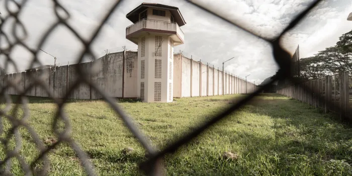 prison with iron fencesprison or jail is a building where people are forced to live if their freedom has been taken awayprison is the building use for punishment prisoner