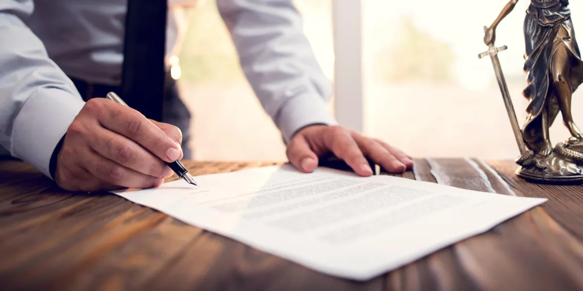 businessman signing an official document