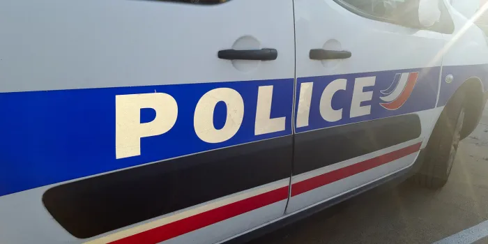 detail of french police car with sun in summer day