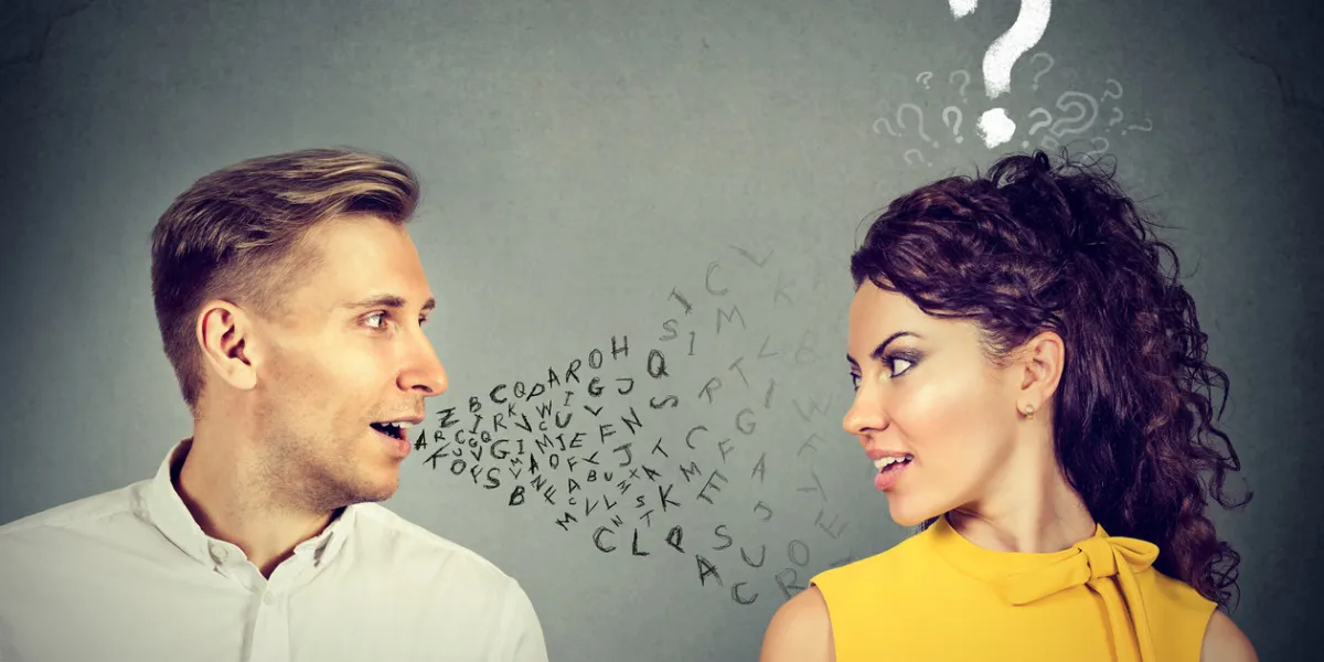 man talking to an attractive woman with question mark